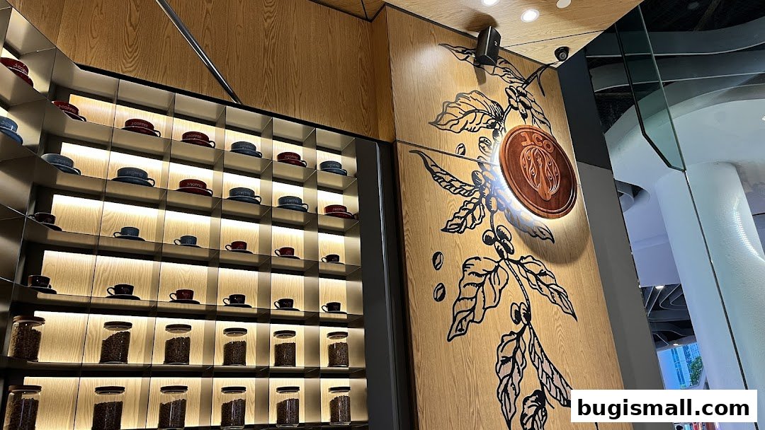 J.CO Donuts & Coffee interior with shelves displaying coffee cups and jars of coffee beans.