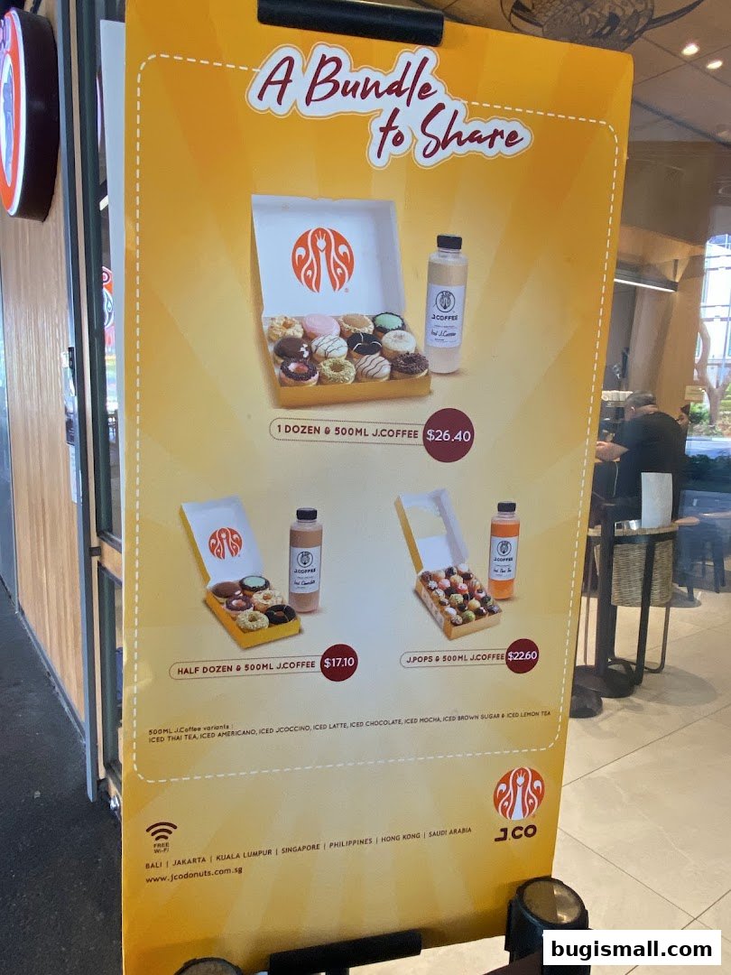 A promotional sign for J.CO Donuts & Coffee featuring donut bundles and coffee.