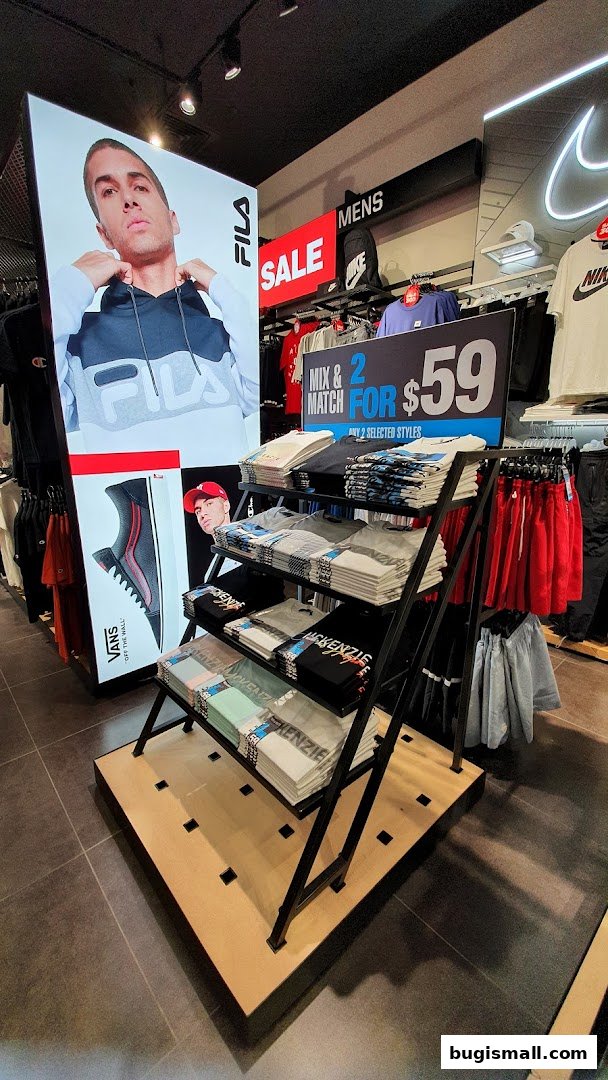 JD Sports store interior with Fila and Nike displays and a mix & match t-shirt offer.