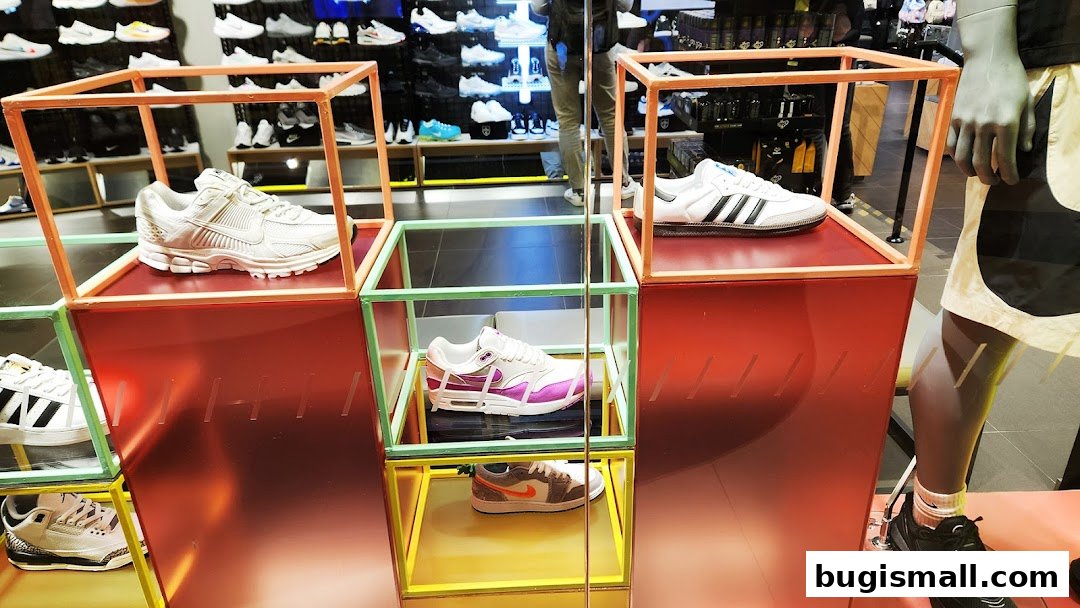 JD Sports store interior showcasing various athletic shoes displayed in colorful cubes.