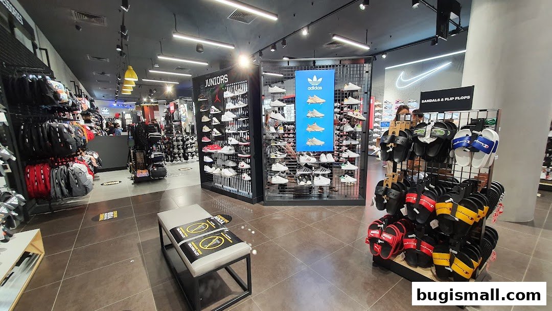 Interior view of a JD Sports store showcasing a wide selection of athletic footwear and accessories.