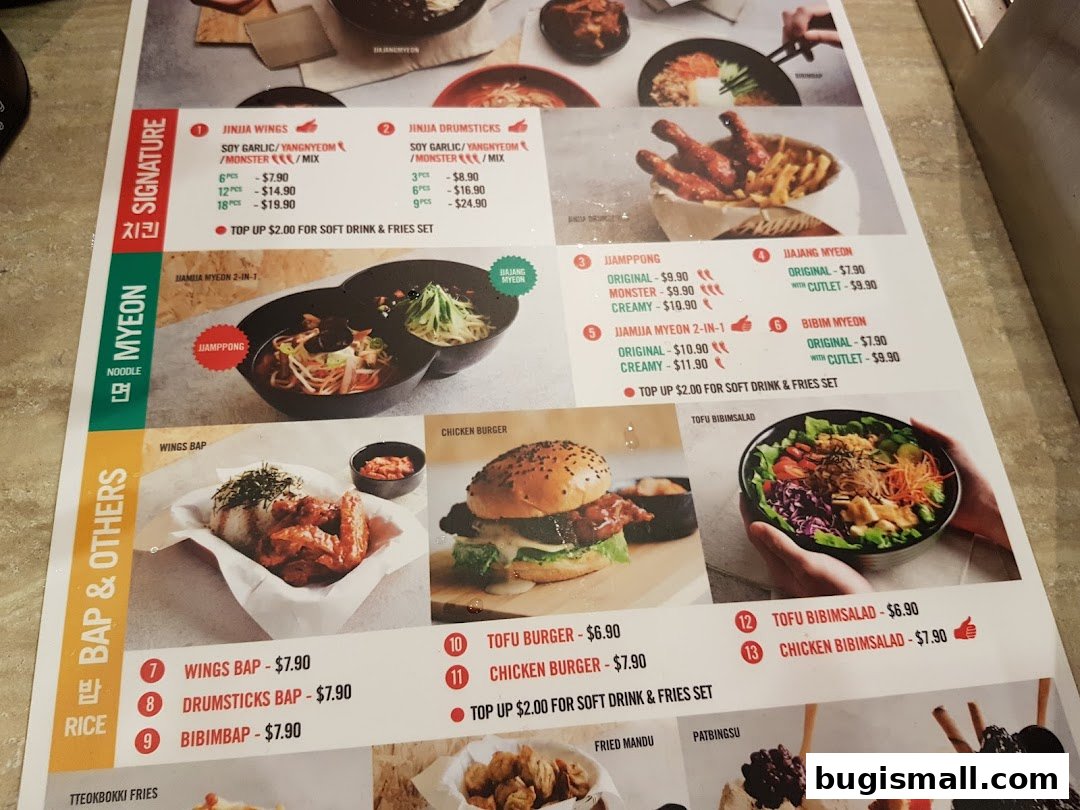A menu from JINJJA Chicken featuring various Korean dishes like wings, noodles, and rice bowls.