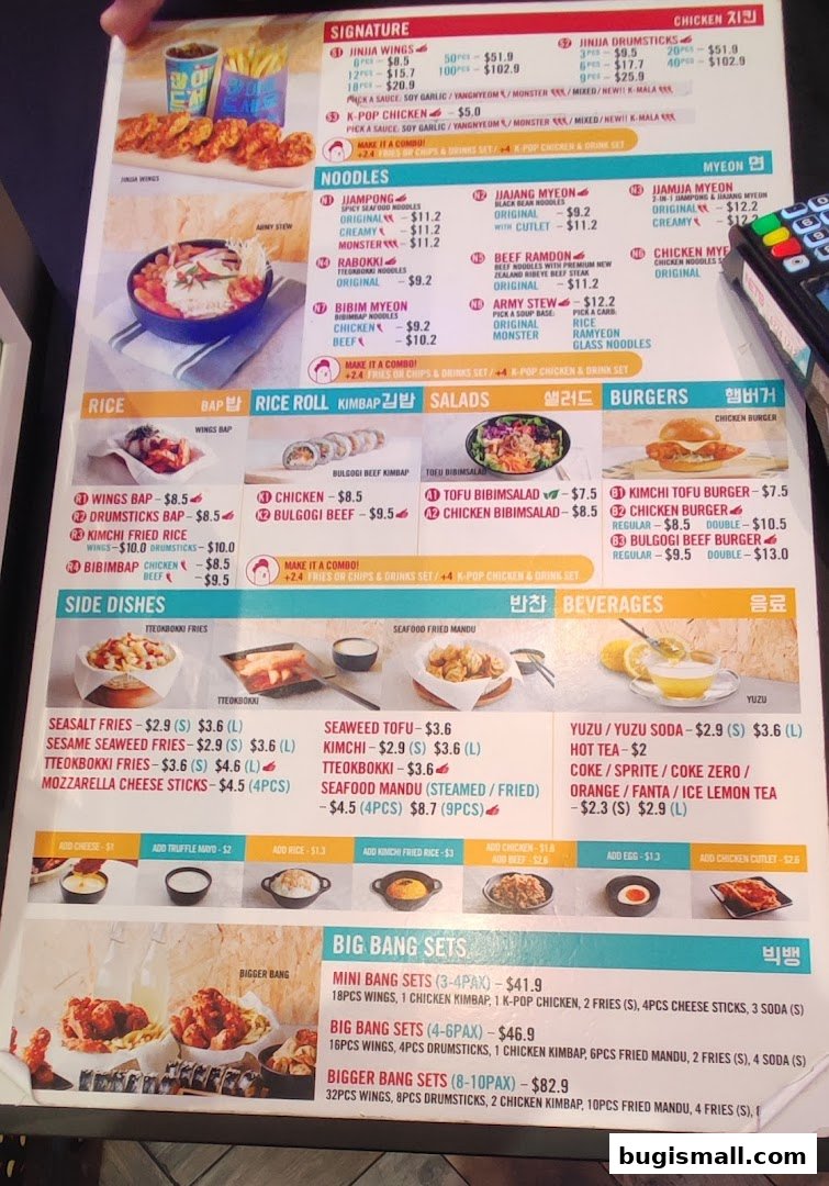 A menu for JINJJA Chicken featuring various Korean fried chicken dishes, noodles, rice, and sides.