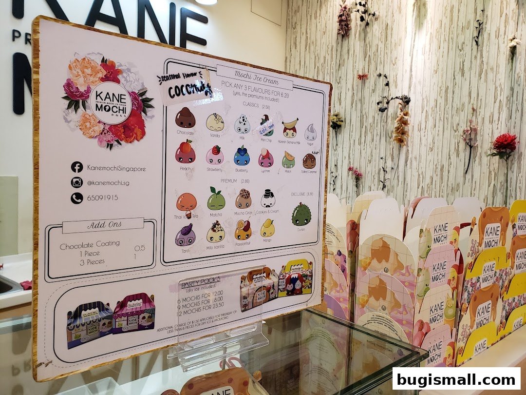 A menu board for Kane Mochi displaying various mochi ice cream flavors and party pack options.