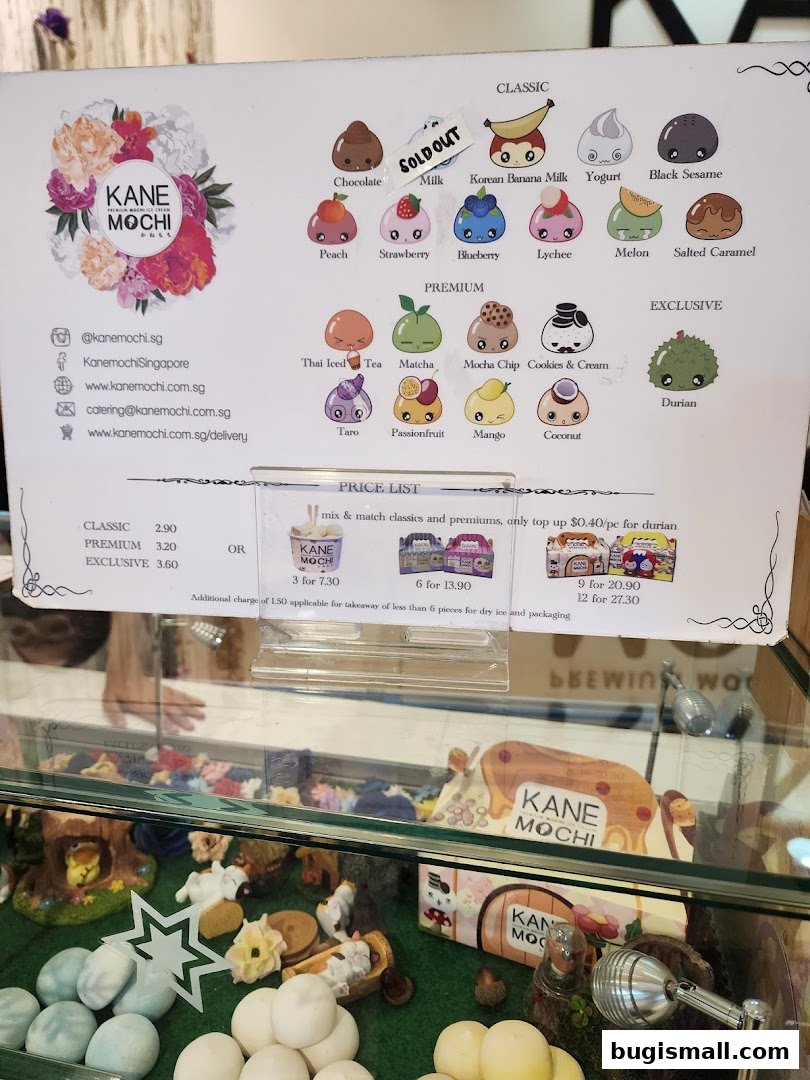 A menu board for Kane Mochi displaying various mochi flavors and prices.