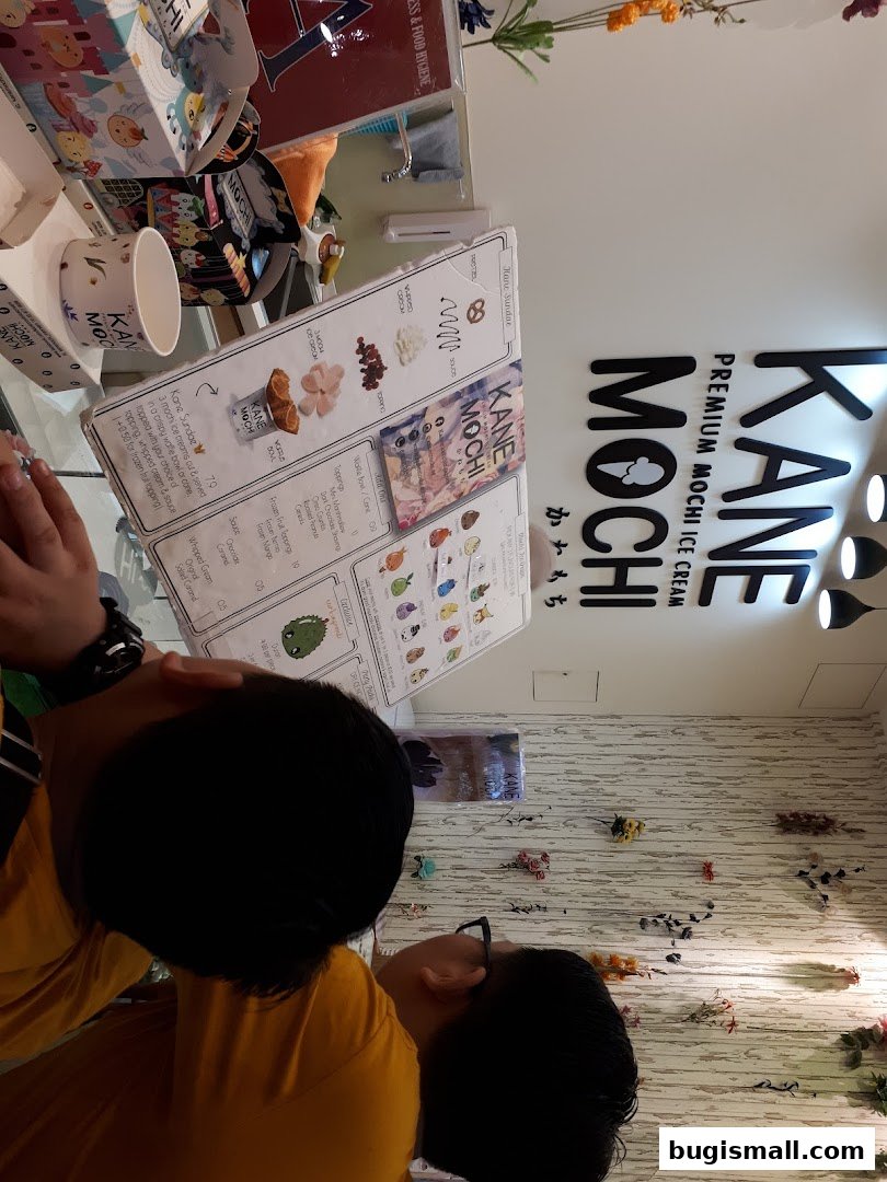 A menu for Kane Mochi Premium Mochi Ice Cream with various toppings and sundae options.