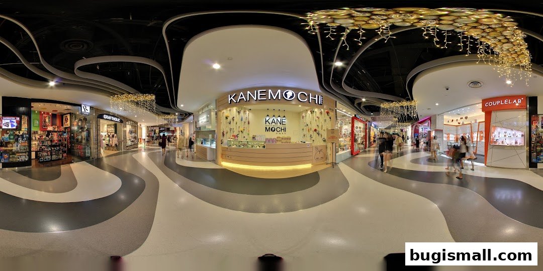 The Kane Mochi shop front in a mall, featuring a light wood counter and decorative floral elements.