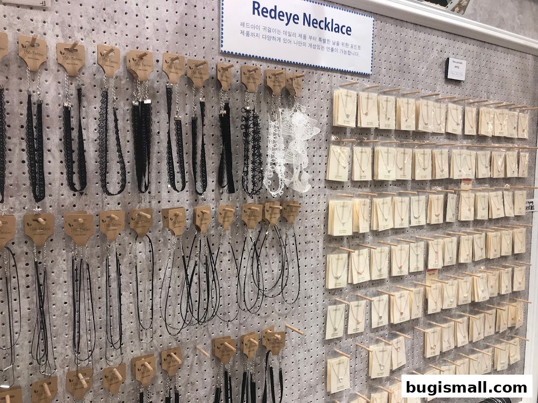 A wall display featuring a variety of necklaces, including chokers and delicate pendant necklaces.