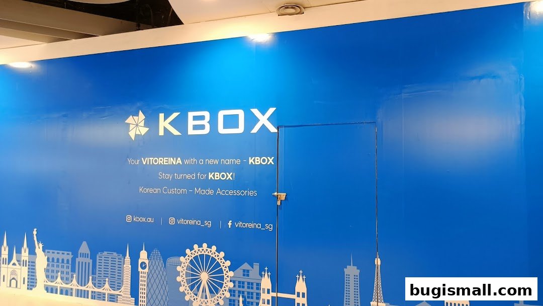 A blue wall with the KBOX logo and text announcing a name change to KBOX.