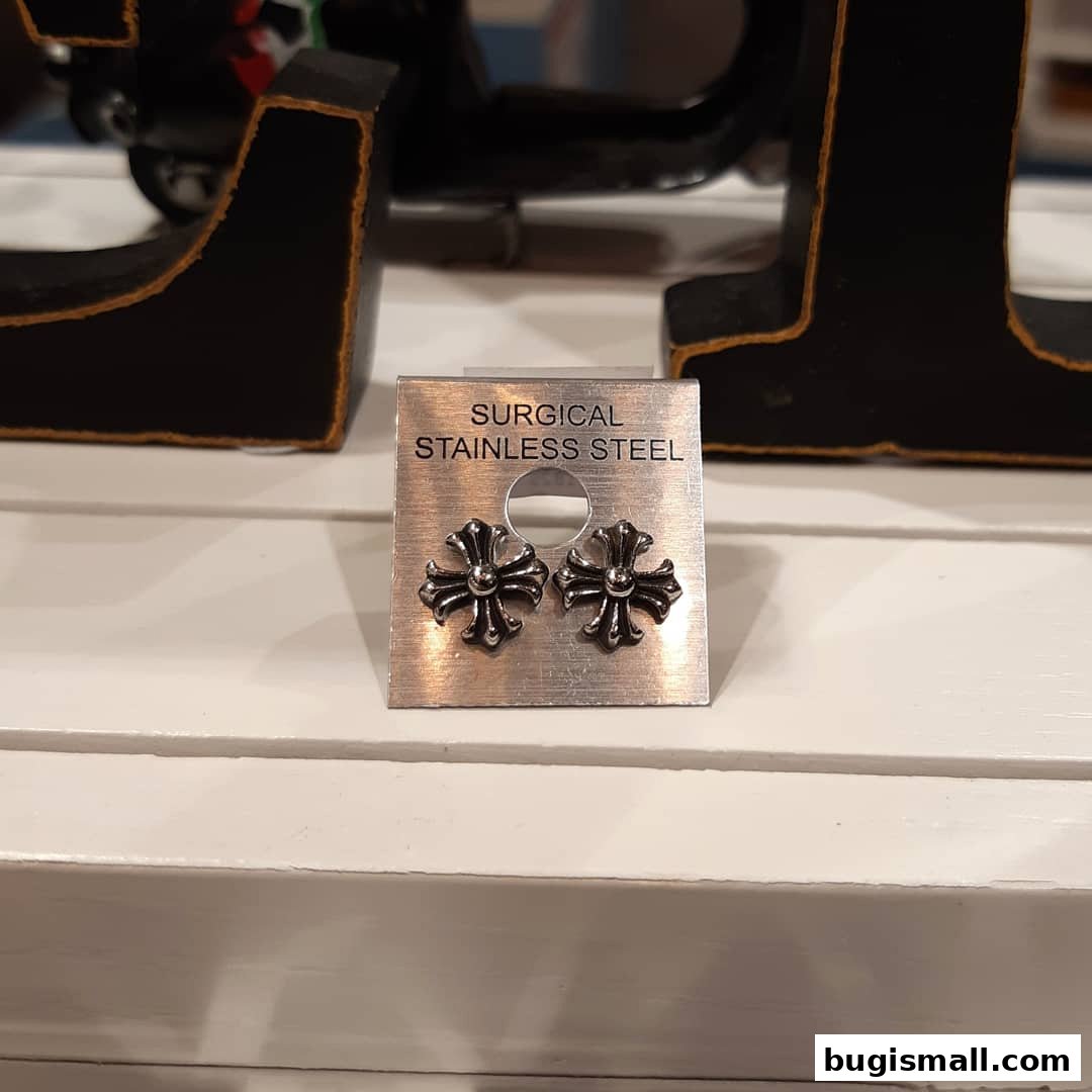 A pair of cross-shaped earrings made of surgical stainless steel.