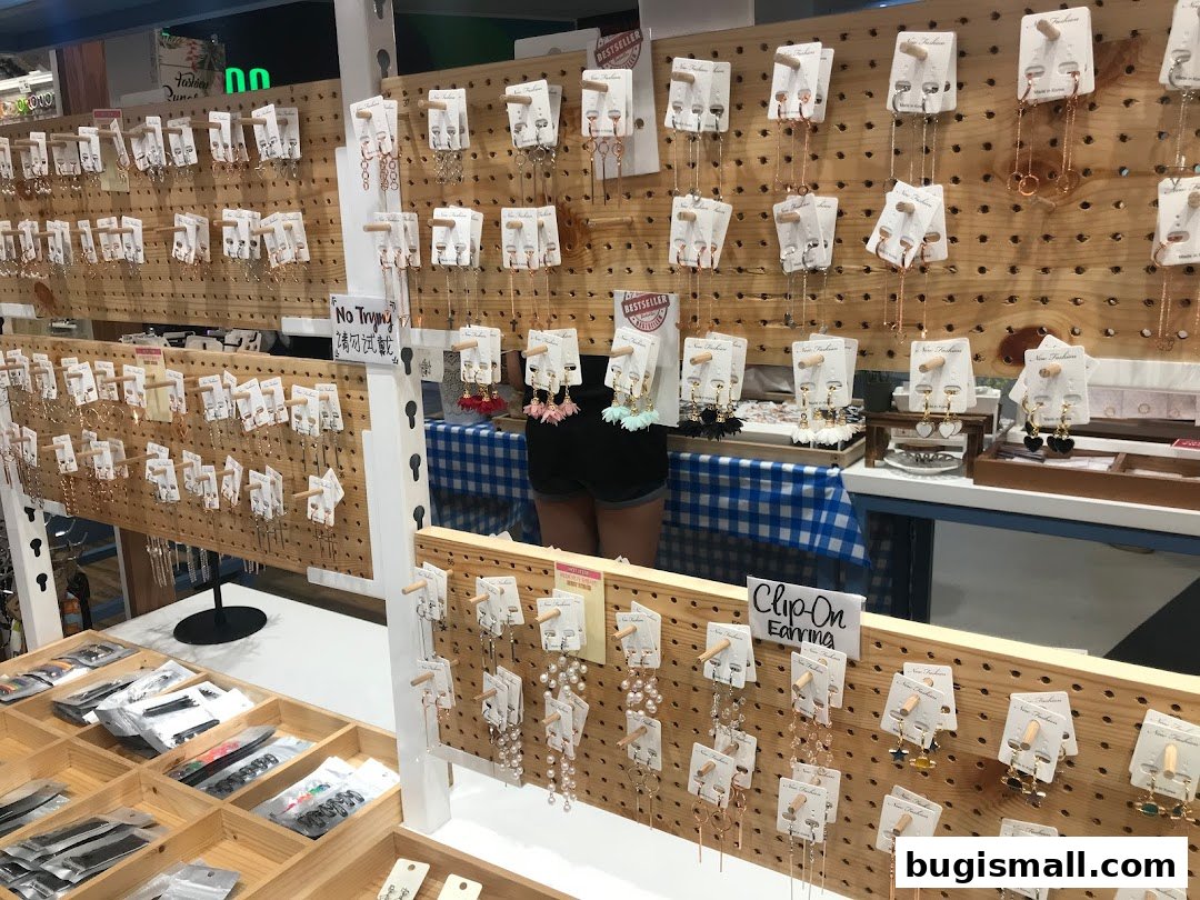 A display of various earrings and jewelry, with some items in packaging.
