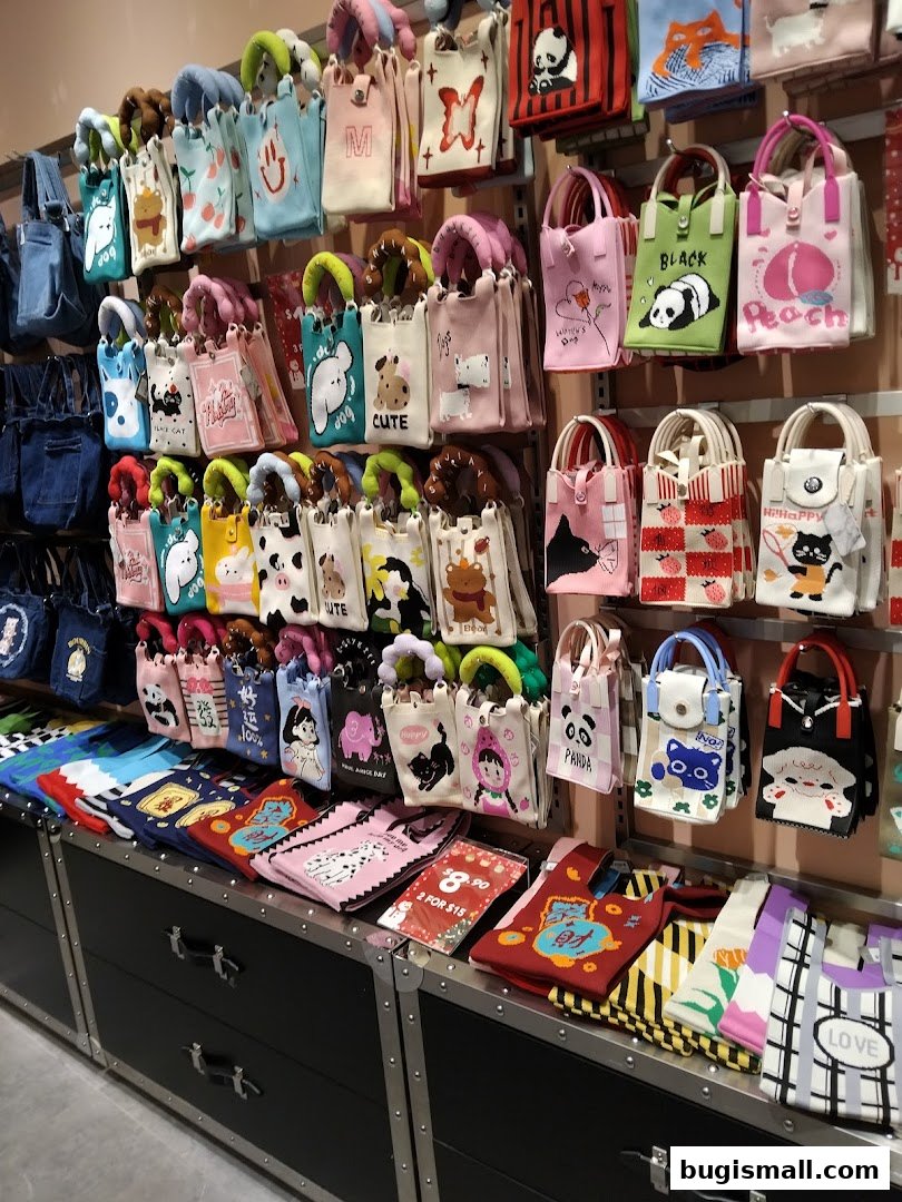 A wall display filled with various small, colorful tote bags featuring cute animal and character designs.