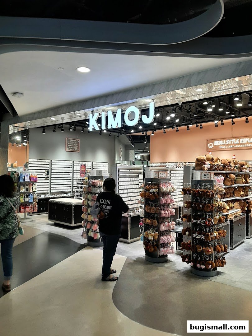 Interior view of a KIMOJ store filled with accessories and plush toys.