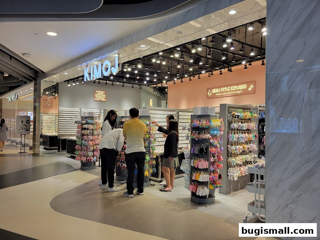 People browsing colorful accessories and jewelry at the KIMOJ store.
