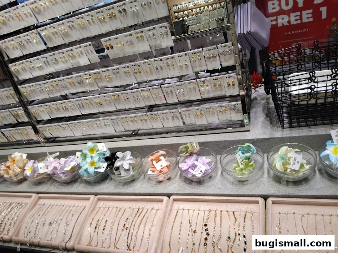 A display of various fashion accessories including earrings, bracelets, and hair clips.