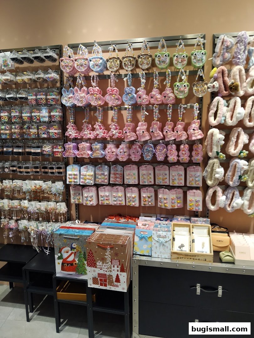 A display of cute accessories, including bags, hair clips, and hair ties, with gift bags at the bottom.