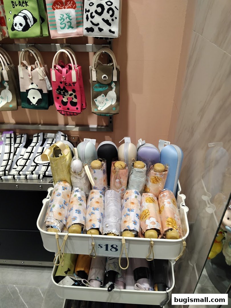 A display of cute, patterned umbrellas and bags with animal designs.
