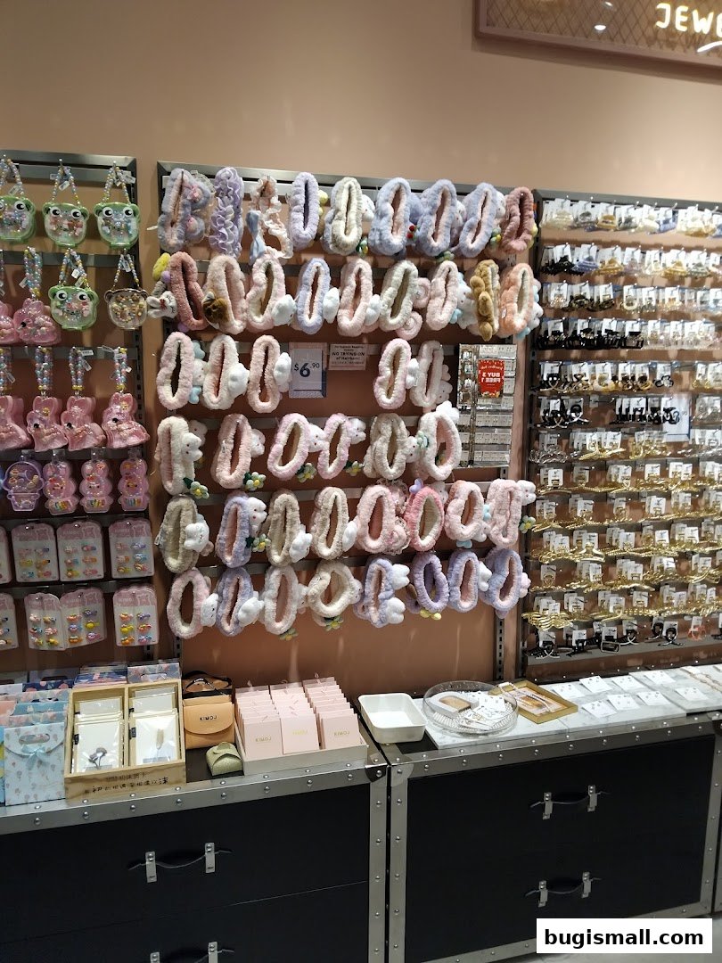 A retail shop display featuring cute hair accessories, bags, and jewelry.