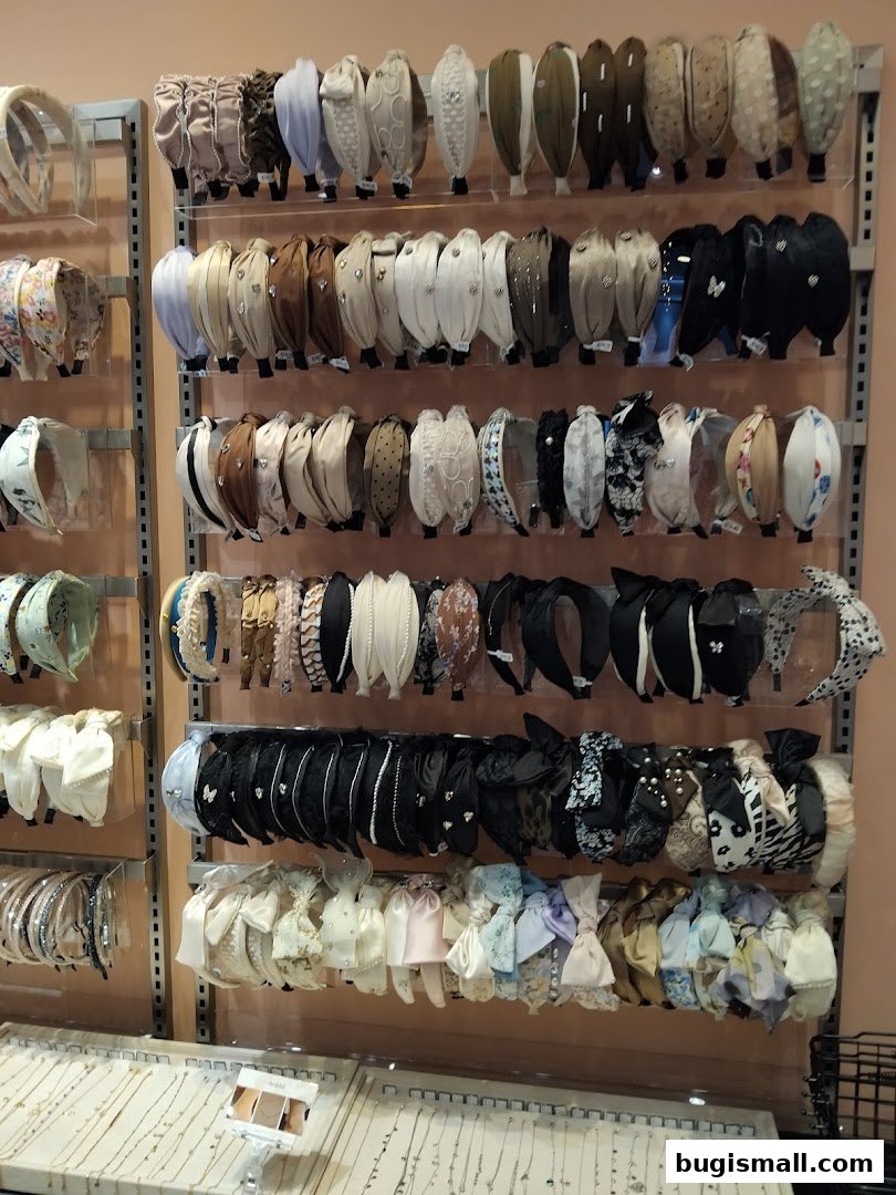 A display of various headbands and hair accessories on shelves.