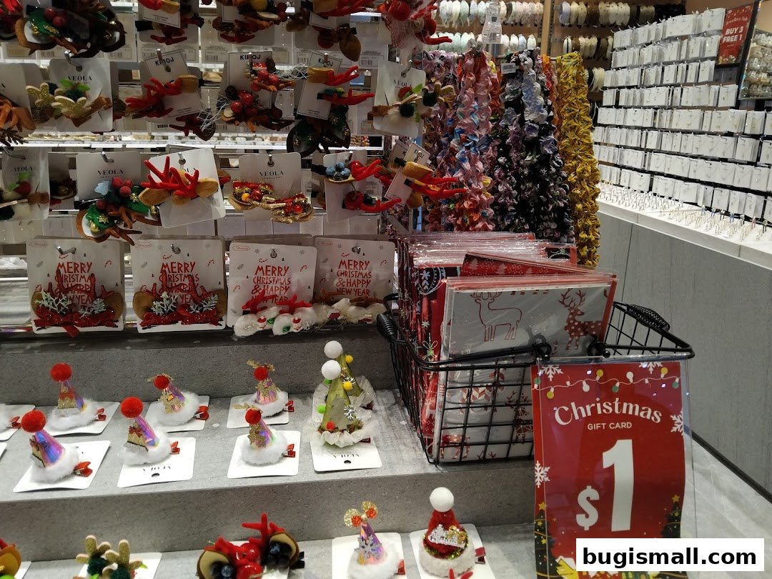 A retail shop display featuring Christmas-themed hair accessories and gift cards.