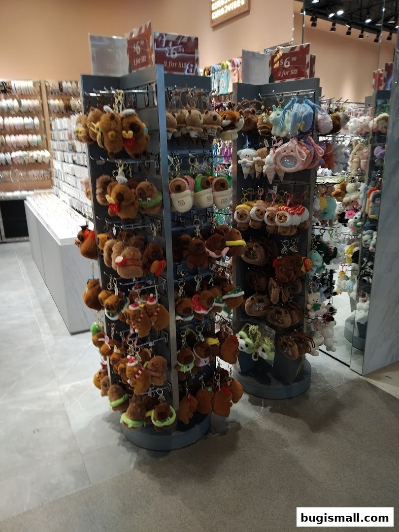 A display of cute plush keychains, including food-themed and animal designs.