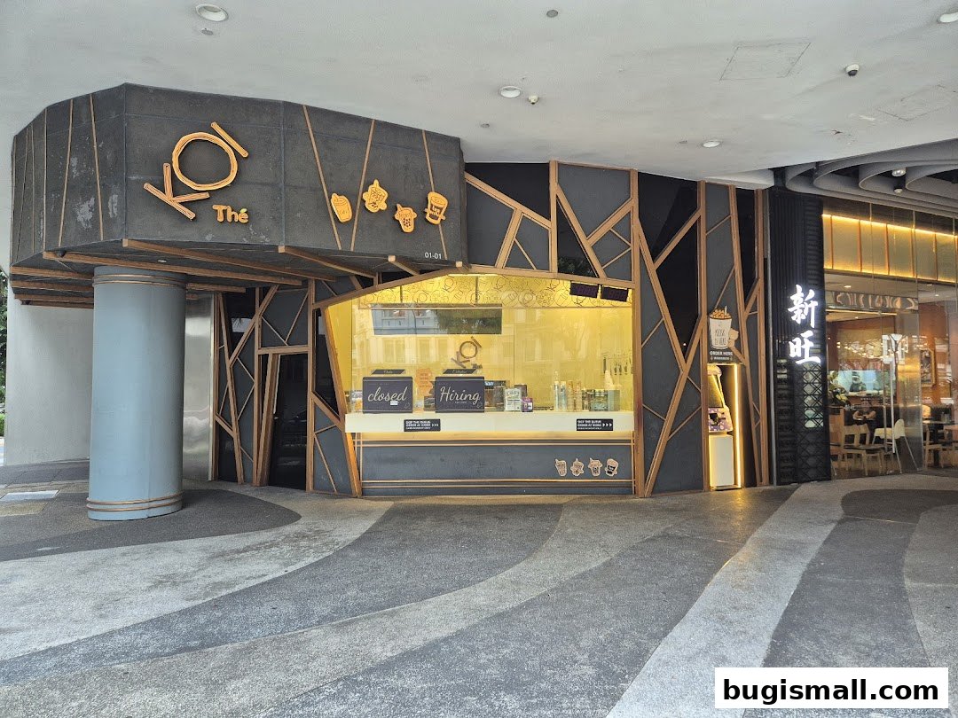 The KOI Thé bubble tea shop front with modern design and illuminated interior.