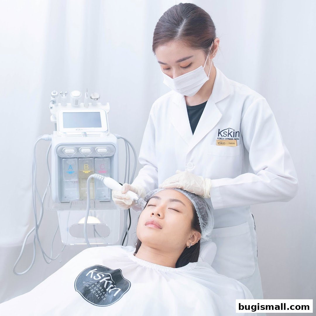 Aesthetician performing a facial treatment on a client with a specialized machine.