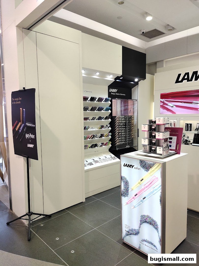 A LAMY store interior showcasing a display of pens and a promotional stand for LAMY Safari pens.