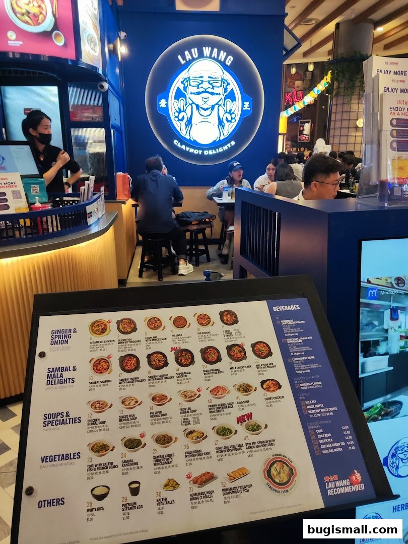 A menu board displays various claypot dishes, vegetables, and beverages offered at Lau Wang Claypot Delights.
