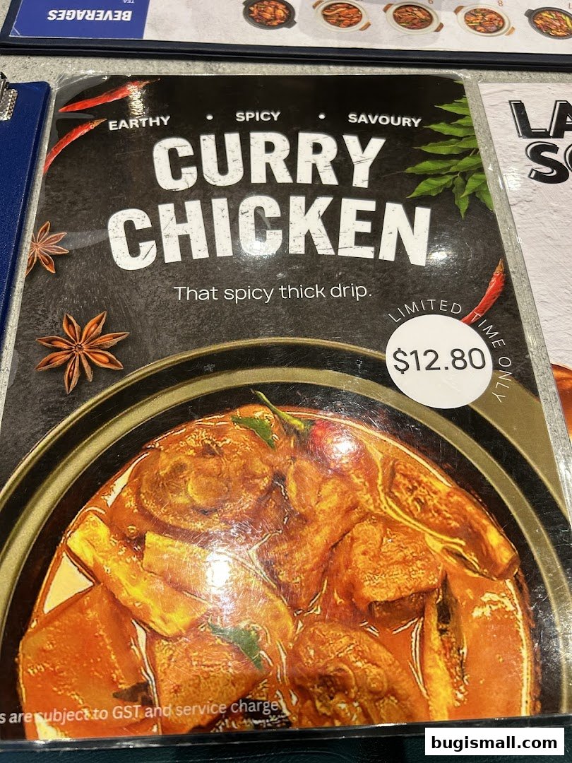 A close-up of a menu item featuring Curry Chicken with a price of $12.80.