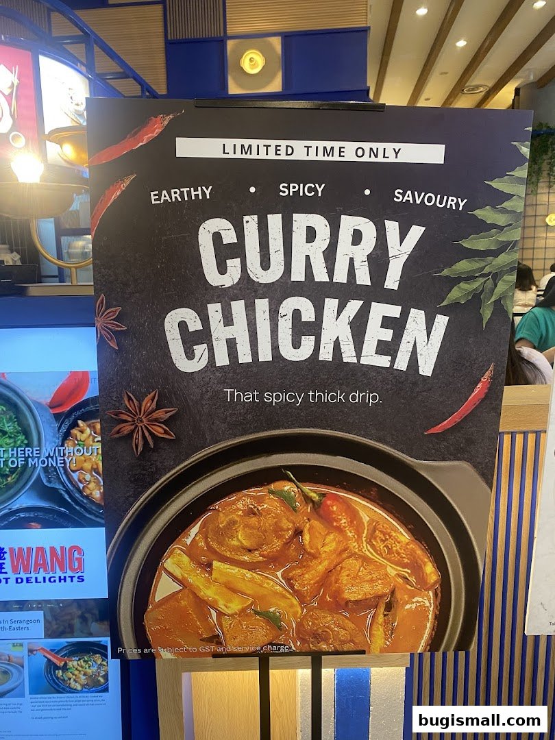 A sign advertising a limited-time Curry Chicken dish with a close-up of the dish.