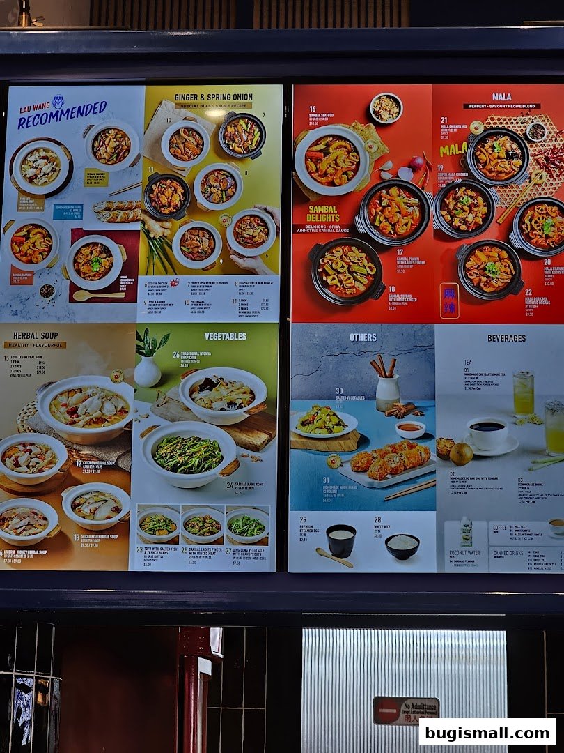 A menu board displaying various claypot dishes, soups, vegetables, and beverages from Lau Wang Claypot Delights.