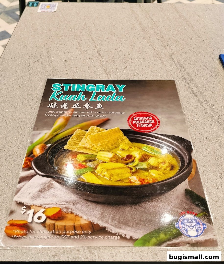 A menu item featuring Stingray Kuah Lada, a traditional Nyonya dish.