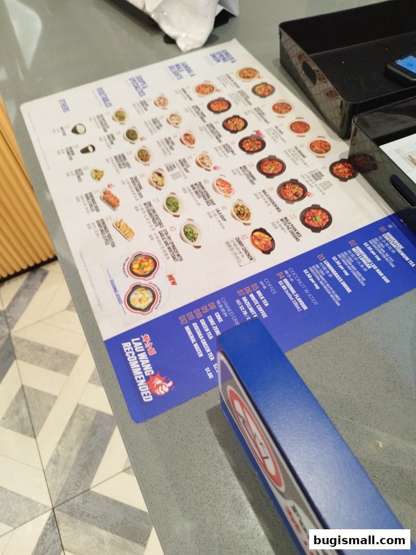 A menu from Lau Wang Claypot Delights featuring various claypot dishes and beverages.