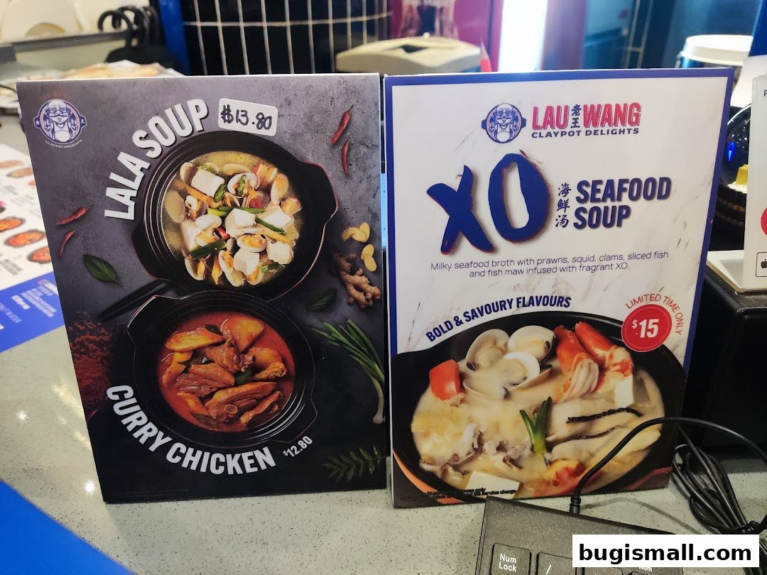 Two menu boards displaying claypot soup dishes from Lau Wang Claypot Delights.