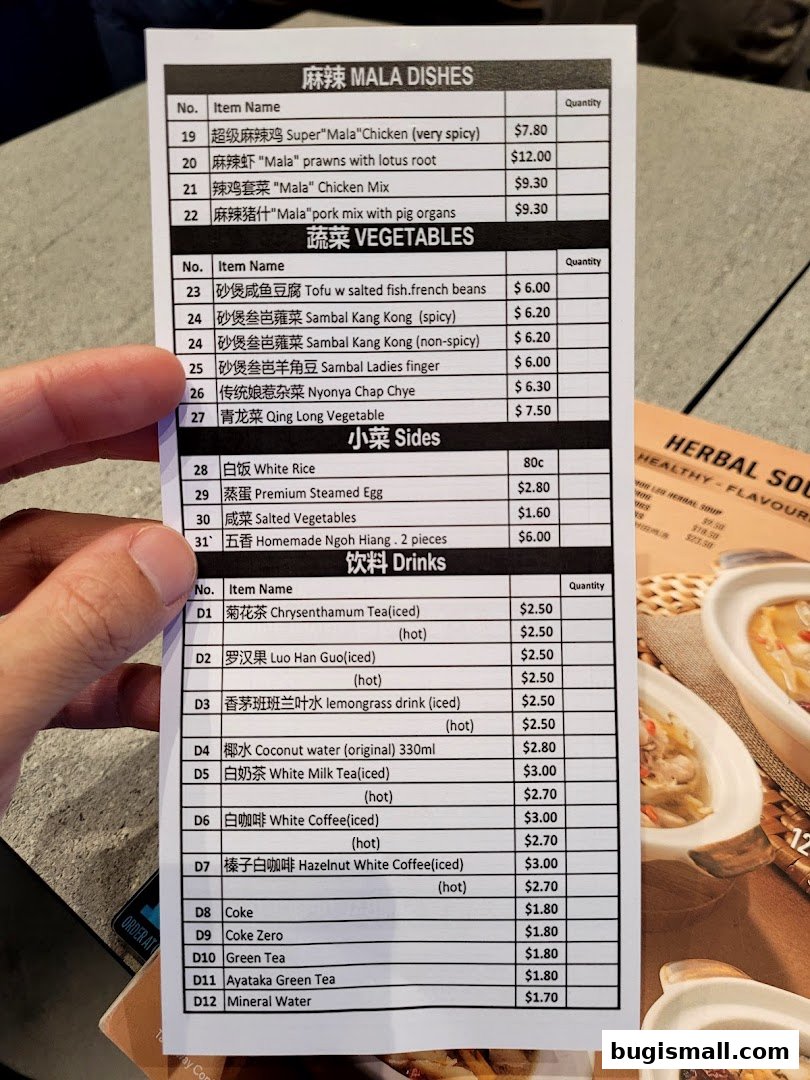 A menu from Lau Wang Claypot Delights featuring Mala dishes, vegetables, sides, and drinks.