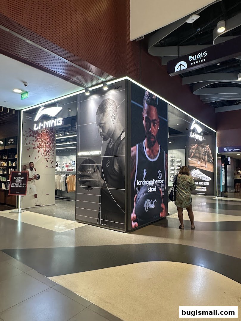 The Li-Ning store at Bugis Street features large graphics of basketball players and merchandise displays.
