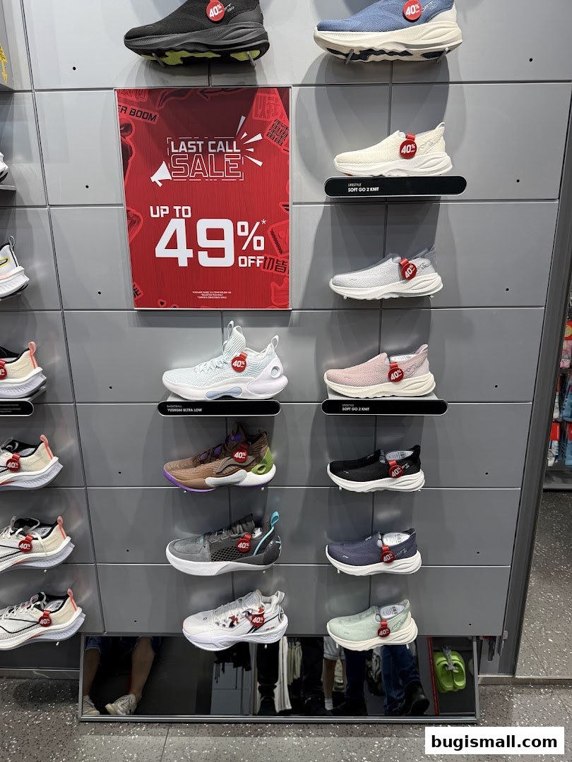 A display of Li-Ning athletic shoes with a 'Last Call Sale' sign offering up to 49% off.