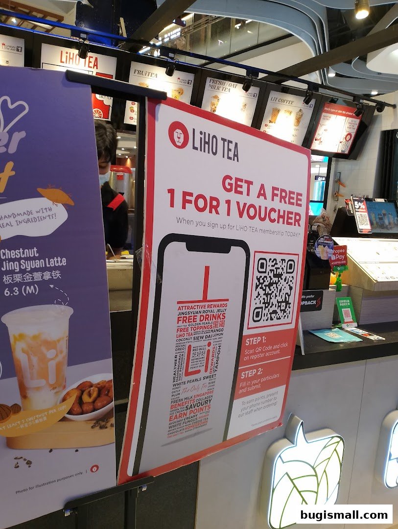A promotional sign for LiHO TEA offering a 1-for-1 voucher with membership sign-up.