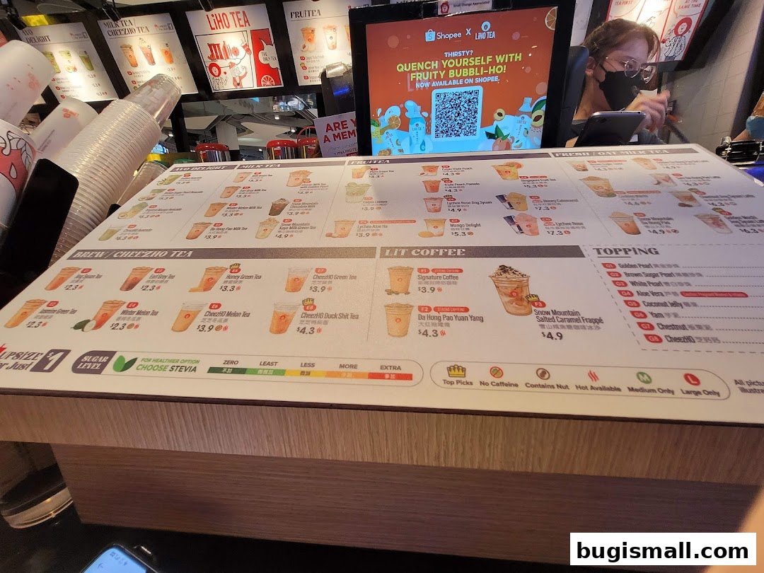 A menu for LiHO TEA featuring various milk teas, fruit teas, coffee, and toppings.