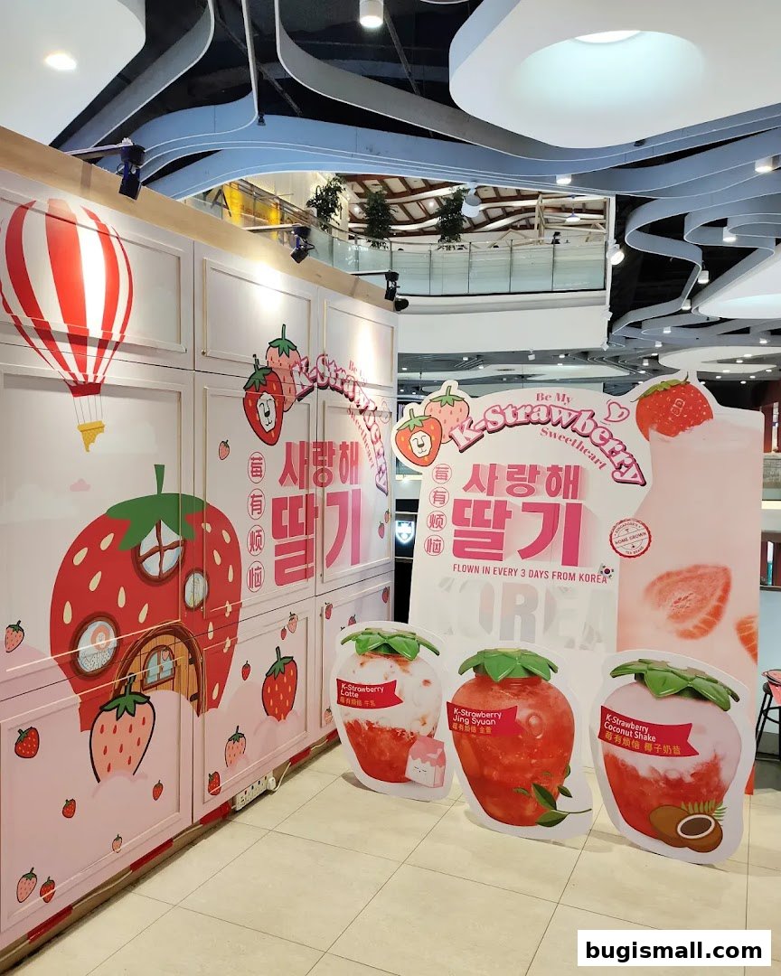 A LiHO TEA stall decorated with strawberry themes and Korean text.