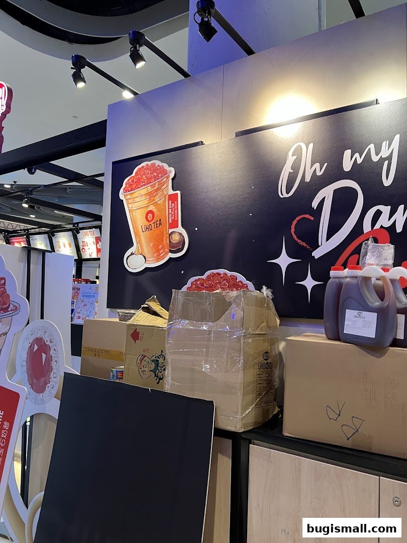 LiHO TEA shop interior with promotional materials and delivery boxes.