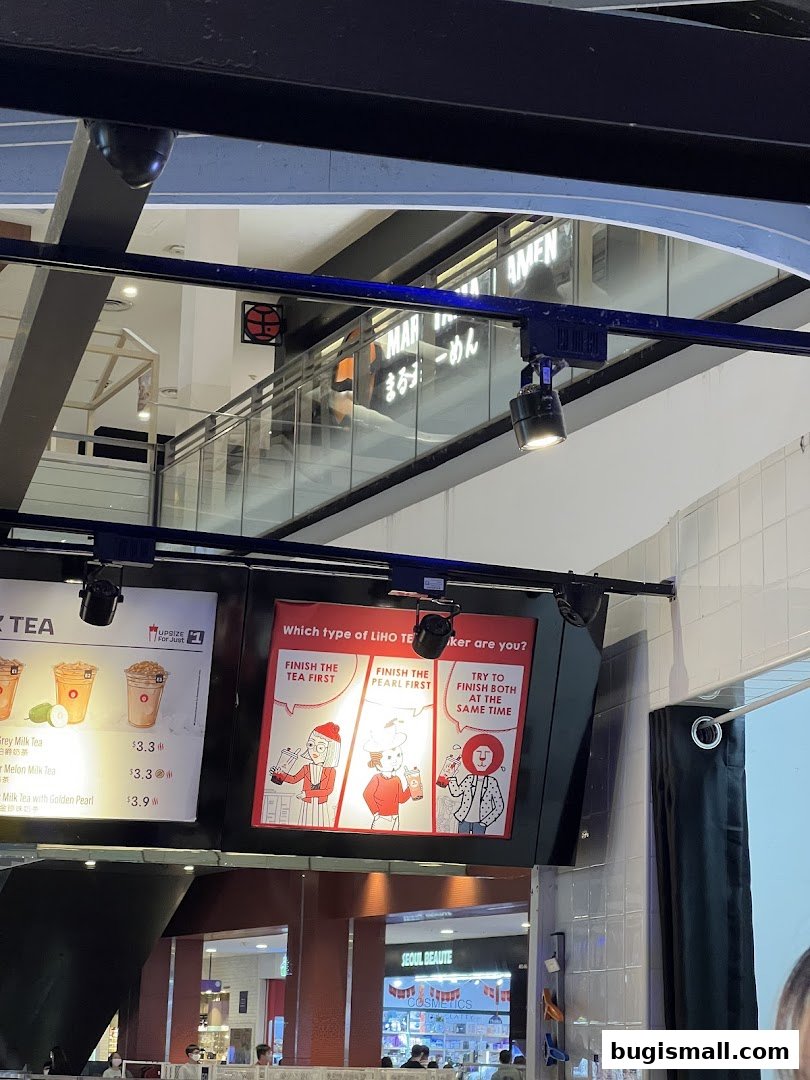 A digital menu board for LiHO TEA displaying drink options and a fun quiz.