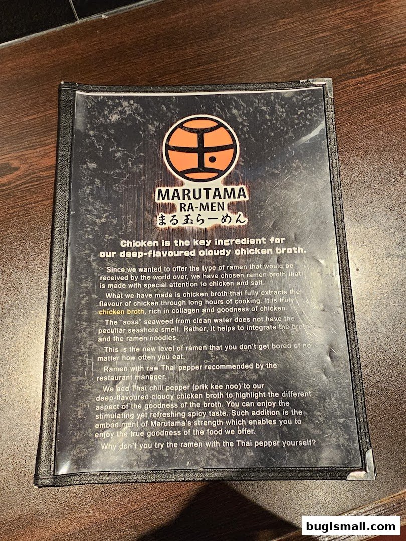 A menu from Marutama Ramen highlighting their signature chicken broth.