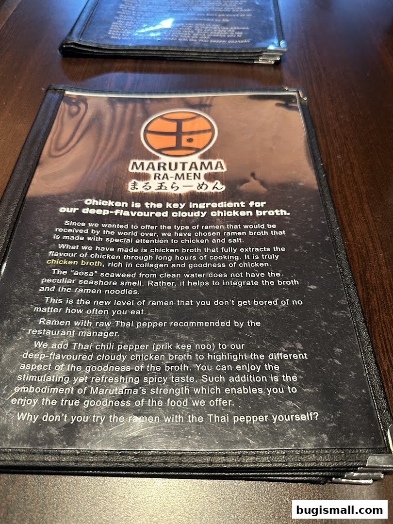 A menu from Marutama Ramen highlighting their signature chicken broth ramen.