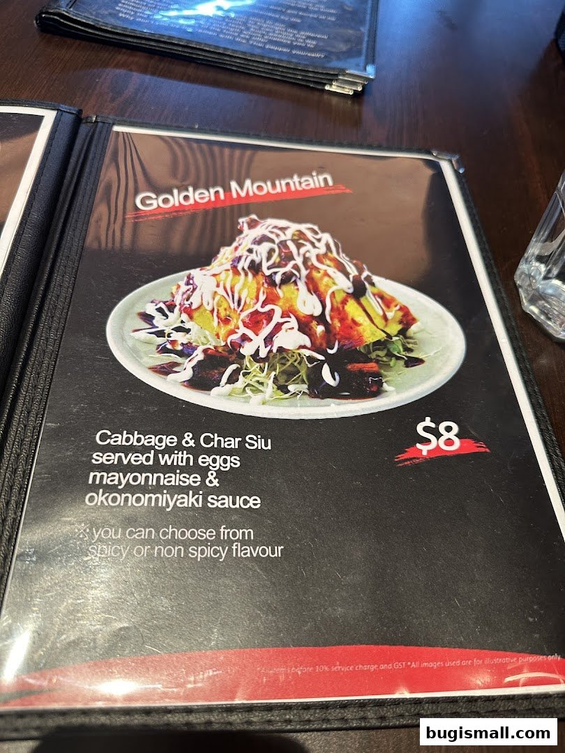 A menu item featuring Golden Mountain Cabbage & Char Siu with eggs, mayonnaise, and okonomiyaki sauce.