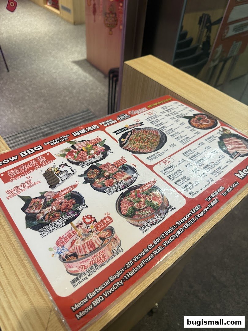 A menu from Meow Barbecue featuring various meat platters and a birthday special.