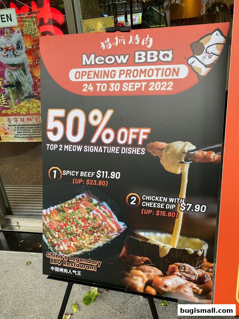 A promotional sign for Meow Barbecue's opening with a 50% off offer on signature dishes.