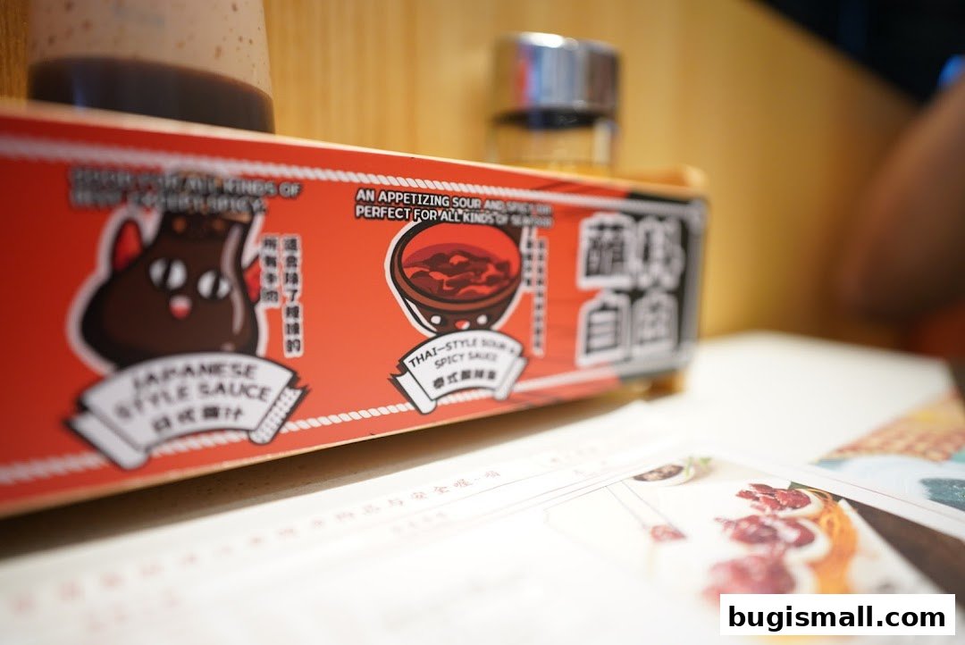 A close-up of a red condiment holder with Japanese and Thai style sauces.