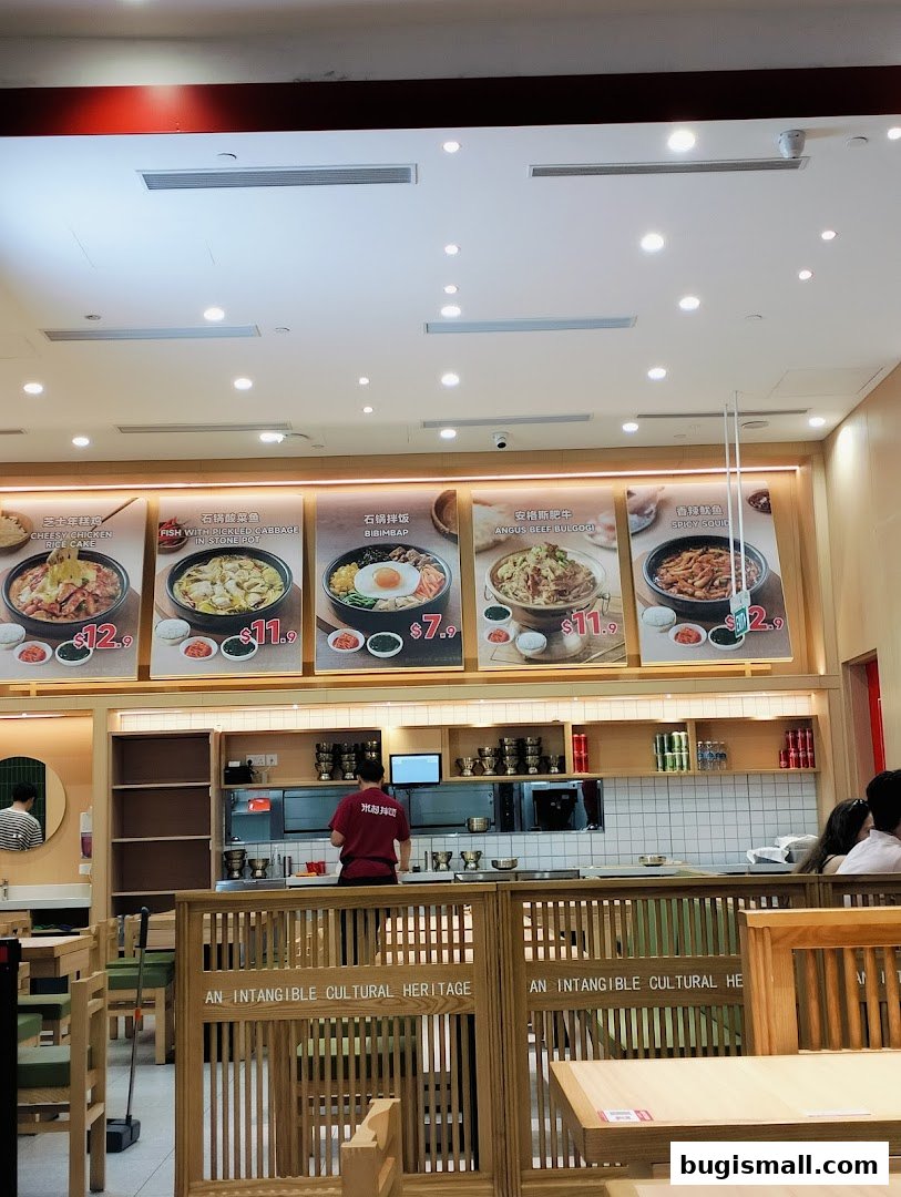 Interior view of MICUN BIBIMBAP restaurant with food displays and seating.